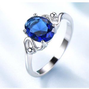 OVAL 7 X 9 SAPPHIRE BLUE CUBIC ZIRCONIA RING
